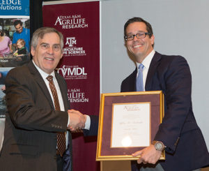 Dr. Jeff Tomberlin, right, with Dr. Craig Nessler, Director of Texas A&M AgriLife Research. Photo by Michael Kellett.
