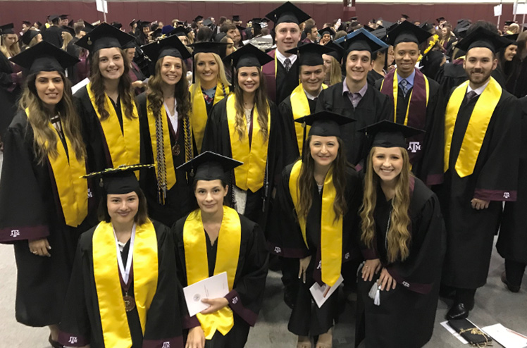 Group of Forensics students waiting to graduate.