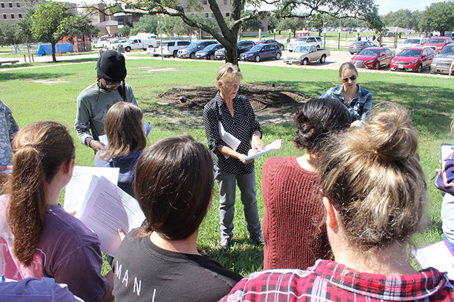 Dr. Jacqueline Aitkenhead-Peterson teaching a group of students in front of the Heep Center