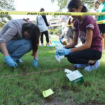 Students investigating at a mock crime scene on the Texas A&M University campus in College Station. Photo by Rob Williams